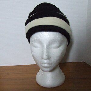 Nicola Gebhard hat black and white fleece material fall winter beehive layered